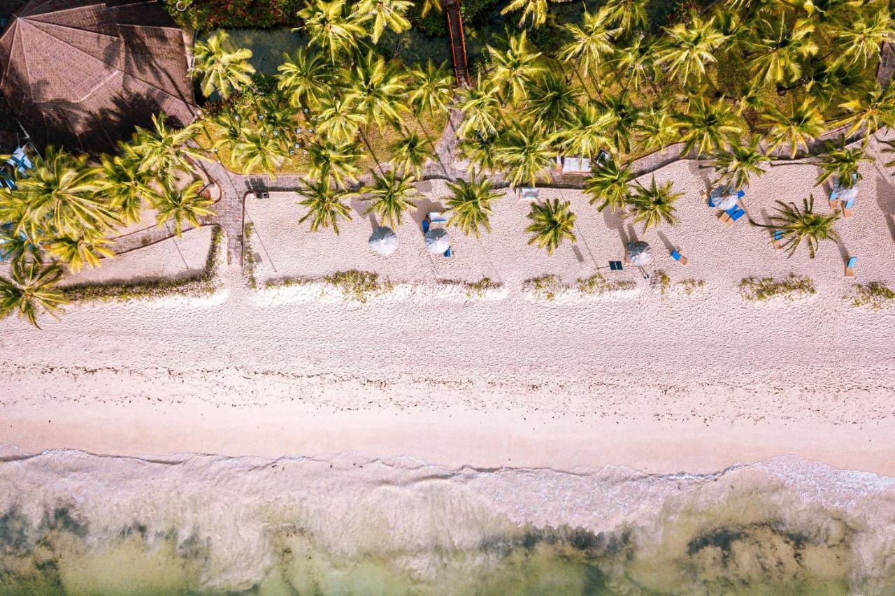 Diani Reef Beach Resort & Spa - Your Beachfront Bliss Awaits Diani Beach Exterior photo Beach at the resort