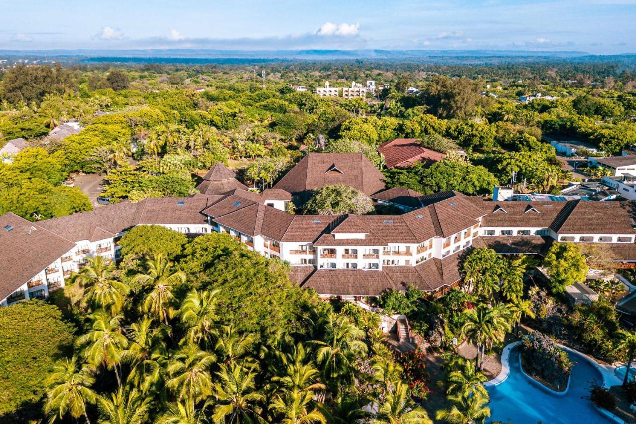 Diani Reef Beach Resort & Spa - Your Beachfront Bliss Awaits Diani Beach Exterior photo Aerial view of the hotel